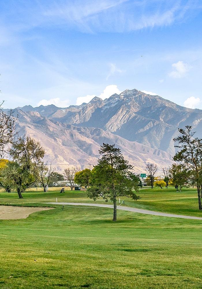 golf course with mountains in the distance